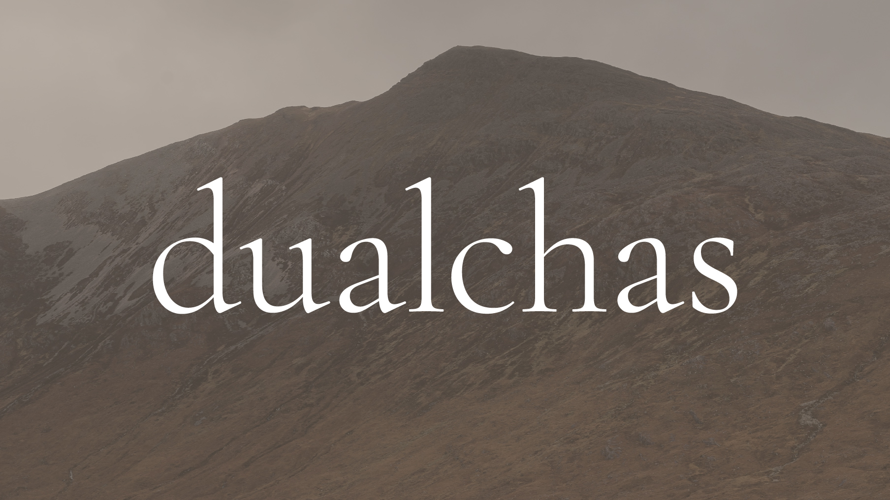 dualchas logo over image of mountain